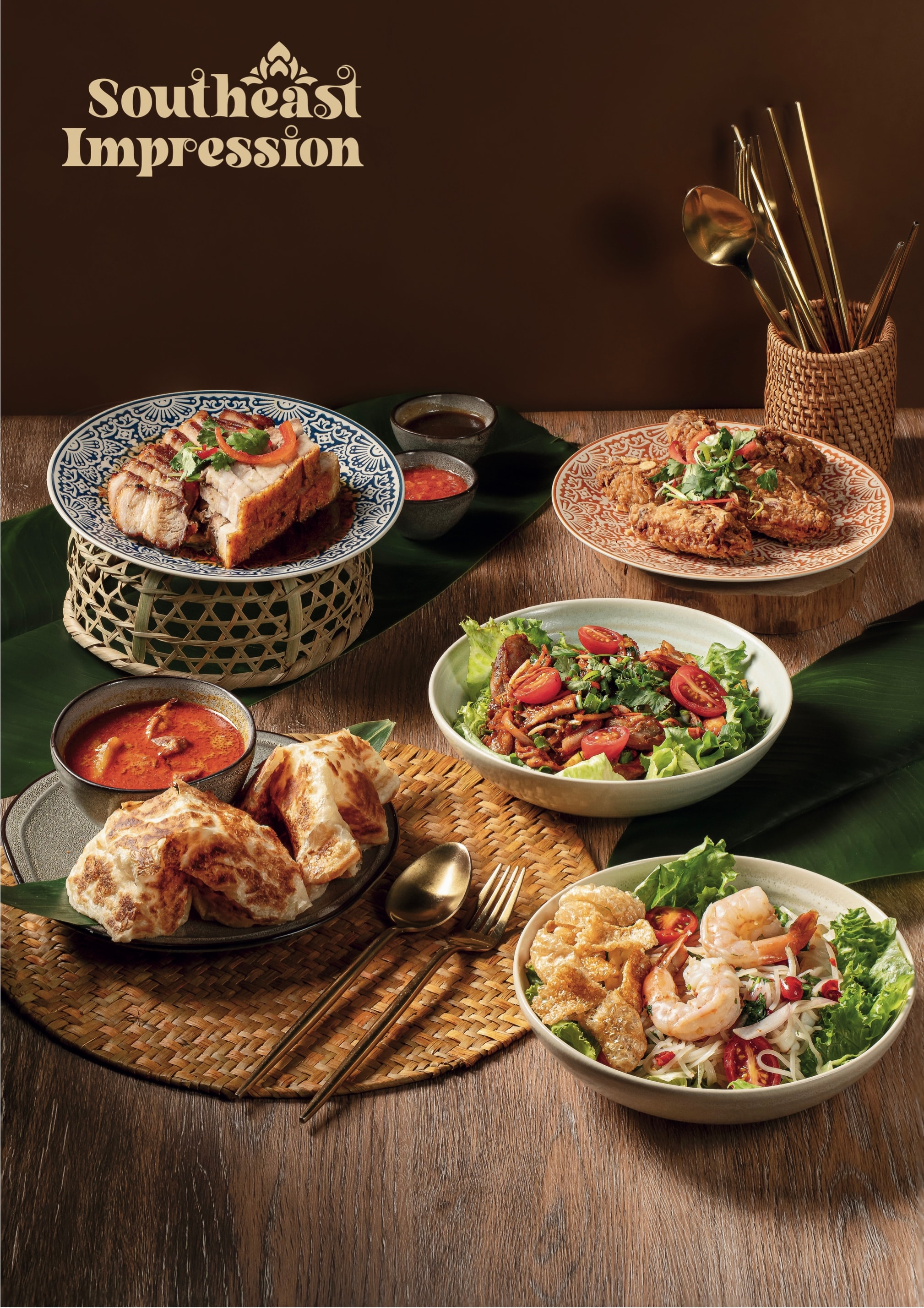 A shared table of satay, roti, curry and salads set for a group